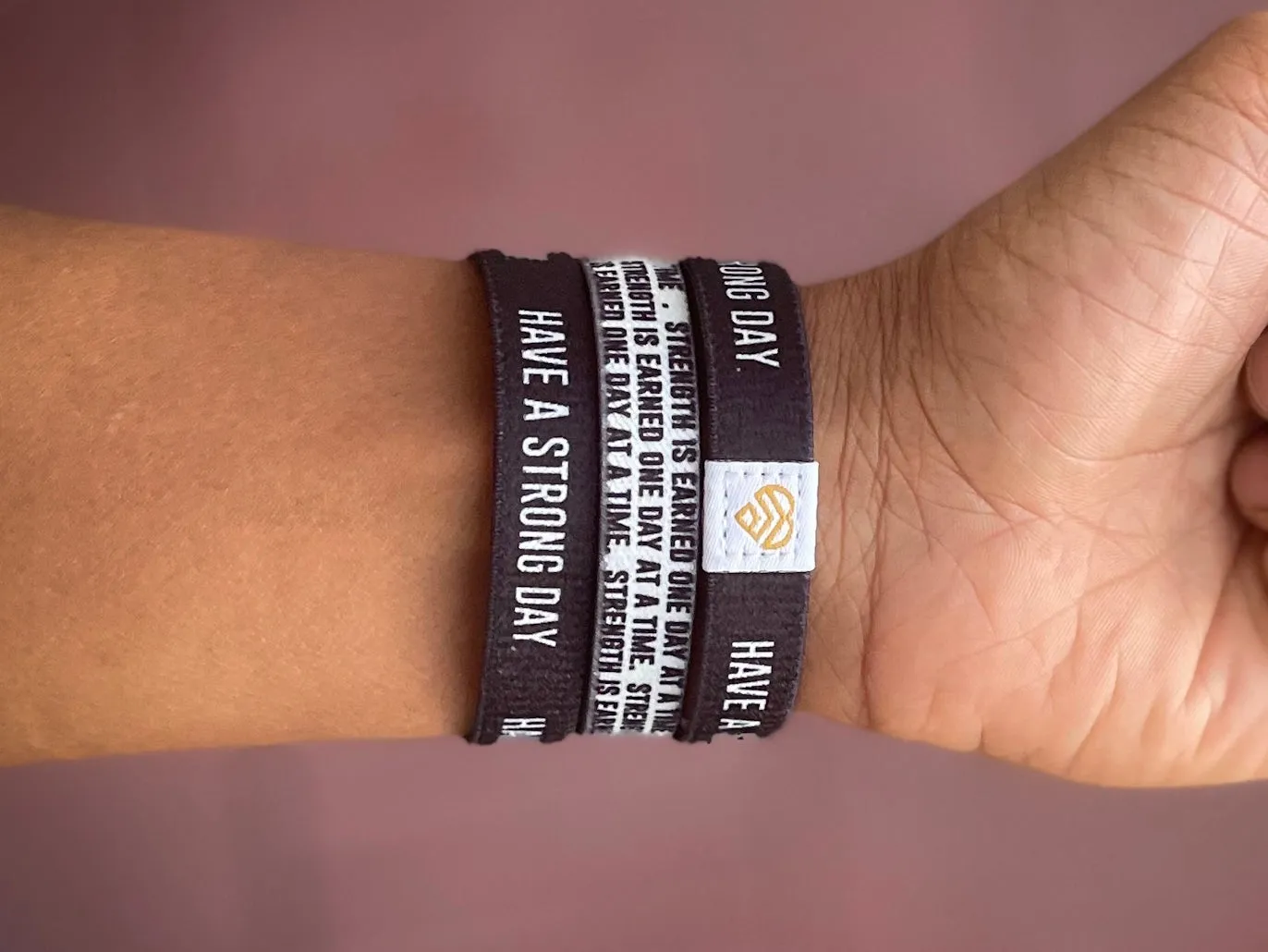 "Strength is earned one day at a time." | Adult Reversible Wristband
